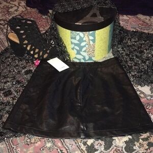 Black mini skirt. Zip up